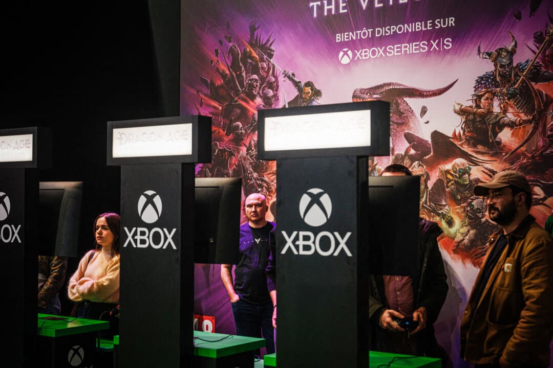 Visitors play the Dragon Age video game by U.S. video game company Electronic Arts during a preview of Paris Games Week on Oct. 22, 2024. (Dimitar Dilkoff/AFP via Getty Images)