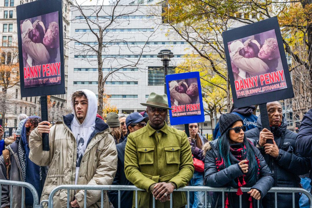 Jordan Neely's uncle, Christopher Neely (C), joins demonstrators before Daniel Penny arrives for jury deliberations, outside the Manhattan Criminal Courthouse in New York City on Dec. 9, 2024. (Alex Kent/Getty Images)