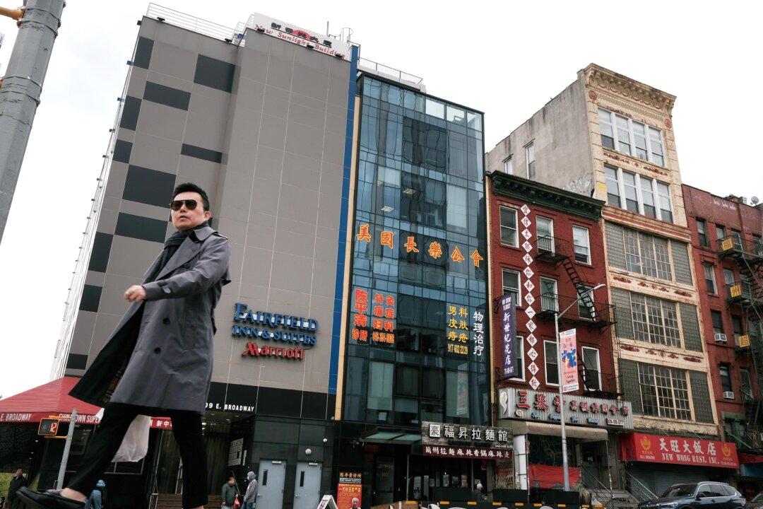 People walk by a building (center) that is suspected of being used as a secret police station in Chinatown for the purpose of repressing dissidents living in the United States on behalf of the Chinese government stands in lower Manhattan in New York City on April 18, 2023. (Spencer Platt/Getty Images)