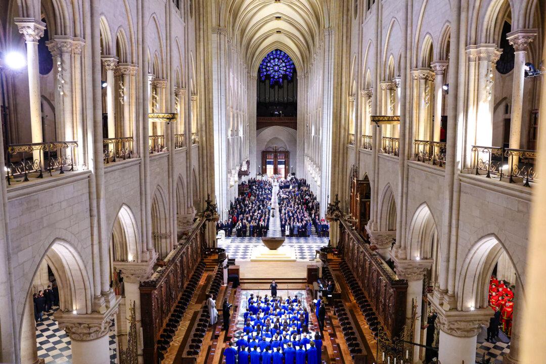 The choir, clergy, and guests stand during a ceremony to mark the reopening of Notre-Dame of Paris Cathedral in Paris on Dec. 7, 2024. After five years of restoration after a 2019 fire, the cathedral reopens its doors to the world in the presence of French President Emmanuel Macron and around 50 heads of state. (Pascal Le Segretain/Getty Images for Notre-Dame de Paris)