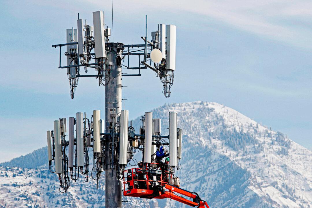 A contract crew for Verizon conducts update work on a cell tower in Orem, Utah, on Dec. 10, 2019. A Beijing-sponsored hacker group is believed to have breached U.S. telecom providers. (George Frey/AFP via Getty Images)