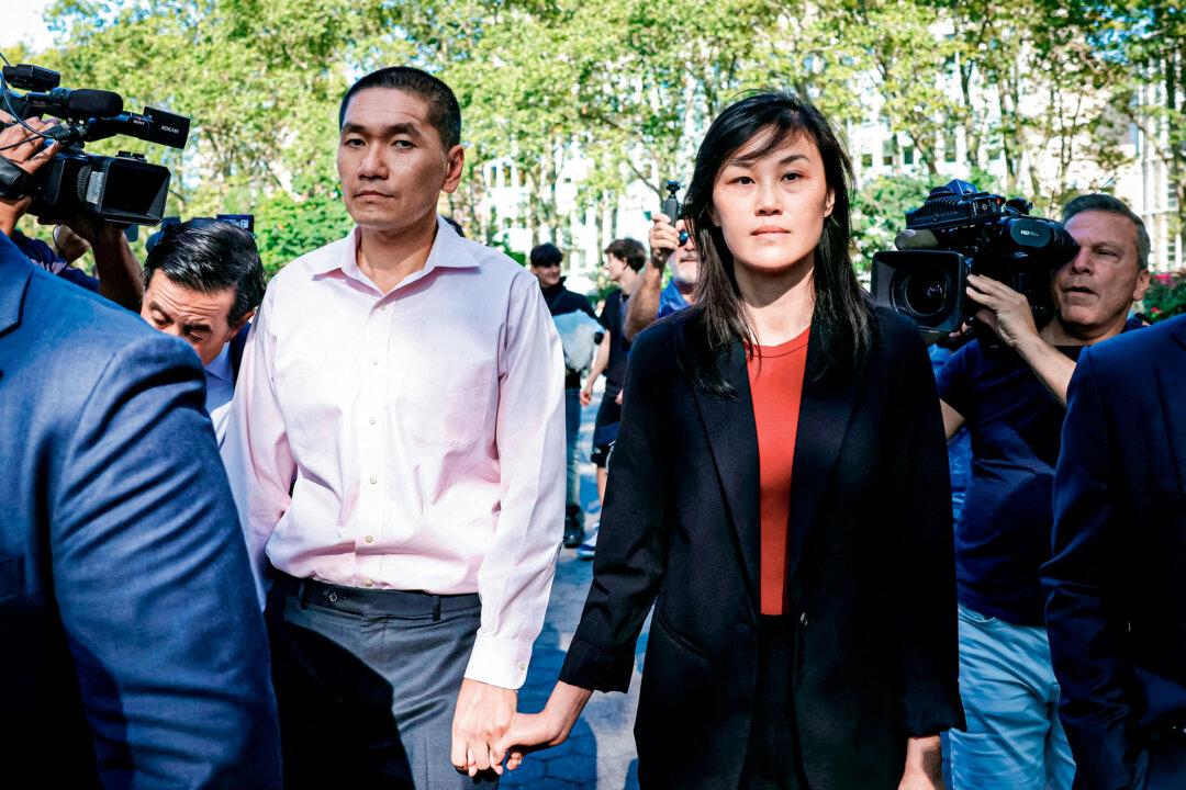 Linda Sun (R), a former aide to New York Gov. Kathy Hochul, and her husband, Chris Hu, exit the federal court in Brooklyn after Sun was charged with acting on behalf of the Chinese Communist Party, in New York City on Sept. 3, 2024. (Kent J. Edwards/Reuters)