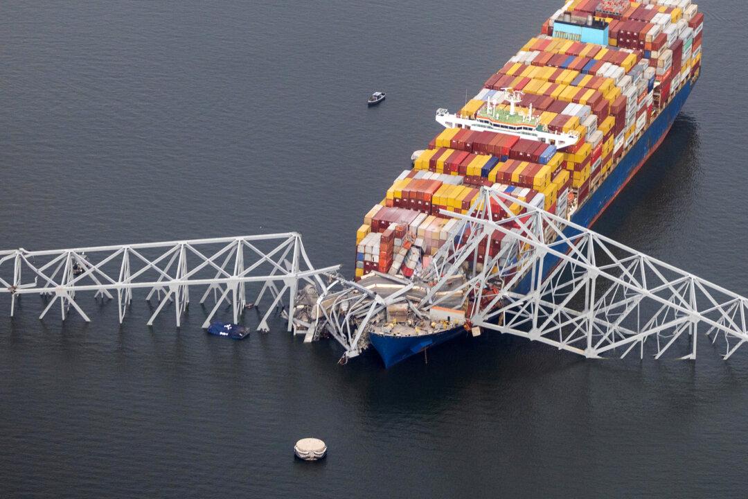 The cargo ship, Dali, sits in the water after colliding into the Francis Scott Key Bridge in Baltimore on March 26, 2024. (Tasos Katopodis/Getty Images)