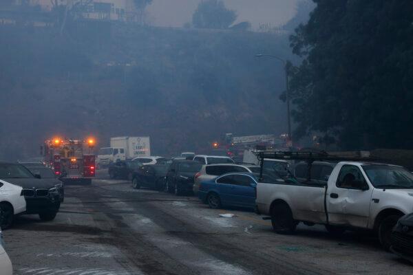 Vehicles are left stranded off the side of the road after residents tried to flee from the Palisades Fire in the Pacific Palisades neighborhood of Los Angeles, on Jan. 7, 2025. (Etienne Laurent/AP Photo)