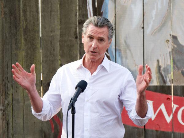 Gov. Gavin Newsom speaks to reporters at the Davis Ranches in Colusa, Calif., on Dec. 10, 2024. (Travis Gillmore/The Epoch Times)