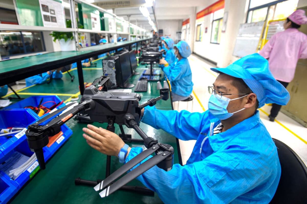 Workers produce drones at a factory in Wuhan, Hubei Province, China, on April 13, 2023. (STR/AFP via Getty Images)