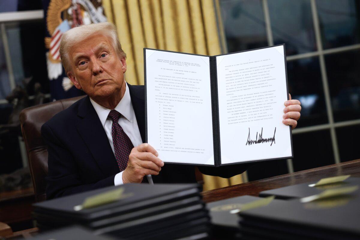 President Donald Trump signs executive orders in the Oval Office on Jan. 20, 2025 in Washington, DC. (Anna Moneymaker/Getty Images)