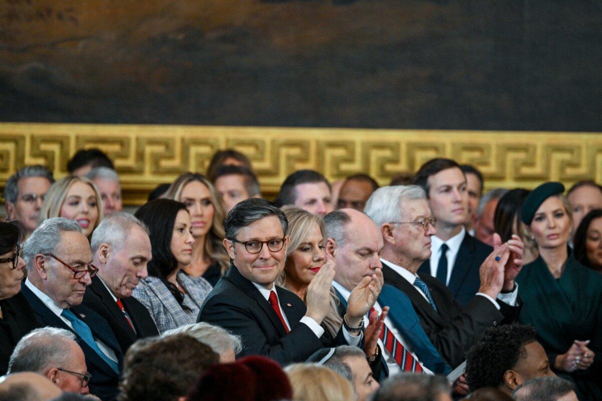 Speaker Mike Johnson listens as President-elect Donald J. Trump speaks after being sworn in during the inauguration of Donald Trump as the 47th president of the United States takes place inside the Capitol Rotunda of the U.S. Capitol building on Jan. 20, 2025. (Kenny Holston / AFP)