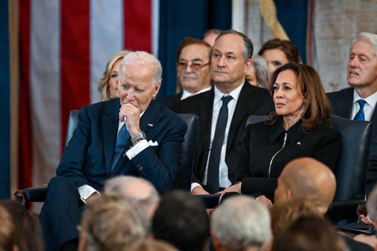 President Joe Biden and Vice President Kamala Harris listen during the inauguration of Donald Trump as the 47th president of the United States takes place inside the Capitol Rotunda of the U.S. Capitol on Jan. 20, 2025. (Kenny Holston / AFP)