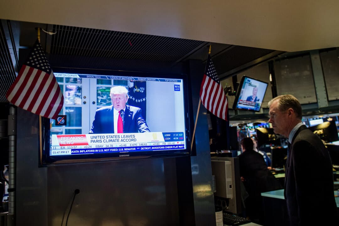 A television broadcasts President Donald Trump's announcement that he is withdrawing the United States from the Paris Climate Accord, at the New York Stock Exchange on June 1, 2017. (Bryan R. Smith/AFP via Getty Images)