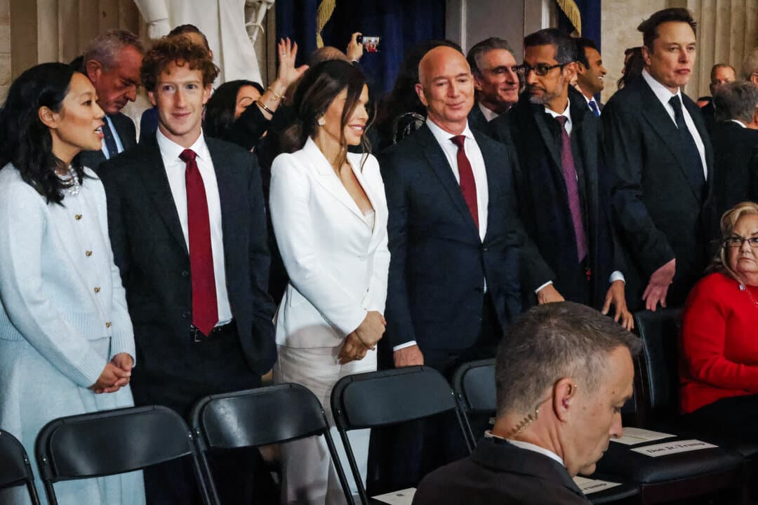 (L–R) Priscilla Chan, Meta founder Mark Zuckerberg, Lauren Sanchez, Amazon founder Jeff Bezos, Alphabet and Google CEO Sundar Pichai, and Tesla CEO Elon Musk attend President Trump's inauguration ceremony in the U.S. Capitol Rotunda on Jan. 20, 2025. (Chip Somodevilla/POOL/AFP via Getty Images)