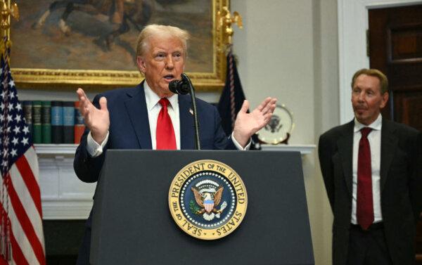 Larry Ellison, executive chairman of Oracle, listens to President Donald Trump speak in the Roosevelt Room at the White House on Jan. 21. (Jim Watson/AFP via Getty Images)