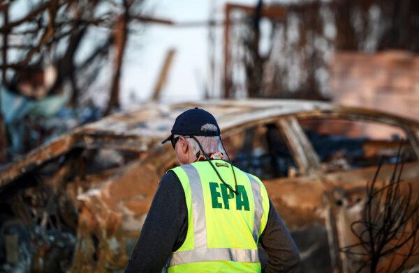 A U.S. Environmental Protection Agency representative works in a residential area burned by the Palisades Fire, in Los Angeles on Jan. 28, 2025. (Mario Tama/Getty Images)
