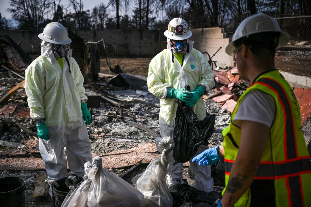 Contractors for the Environmental Protection Agency remove hazardous waste as they search the burn area after the Eaton Fire in the Altadena neighborhood of Los Angeles County on Jan. 30, 2025. (Patrick T. Fallon/AFP via Getty Images)