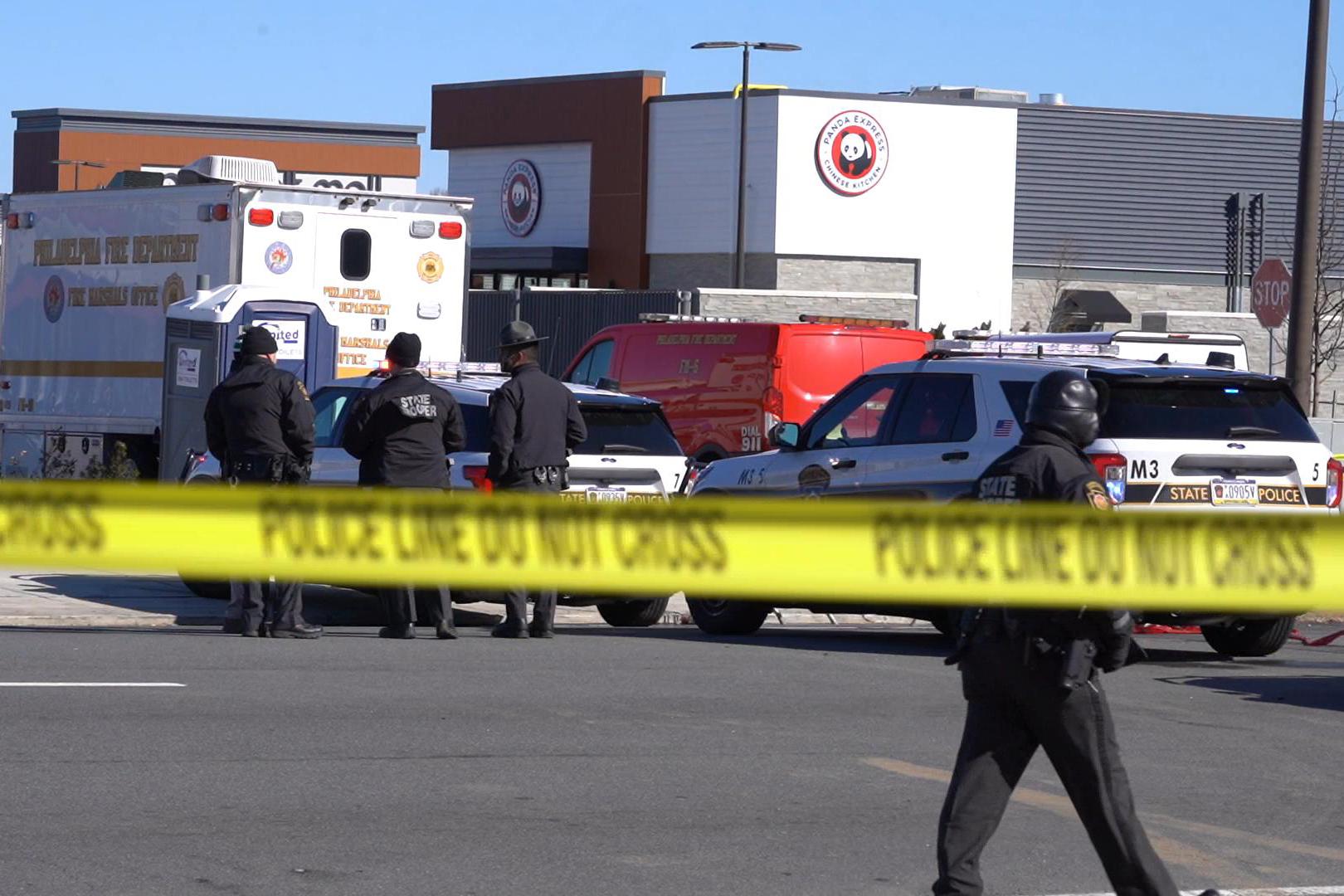 Police enforce the law near the crash site at Roosevelt Mall in Northeast Philadelphia, Penn., on Feb. 1, 2025. (William Huang/The Epoch Times)