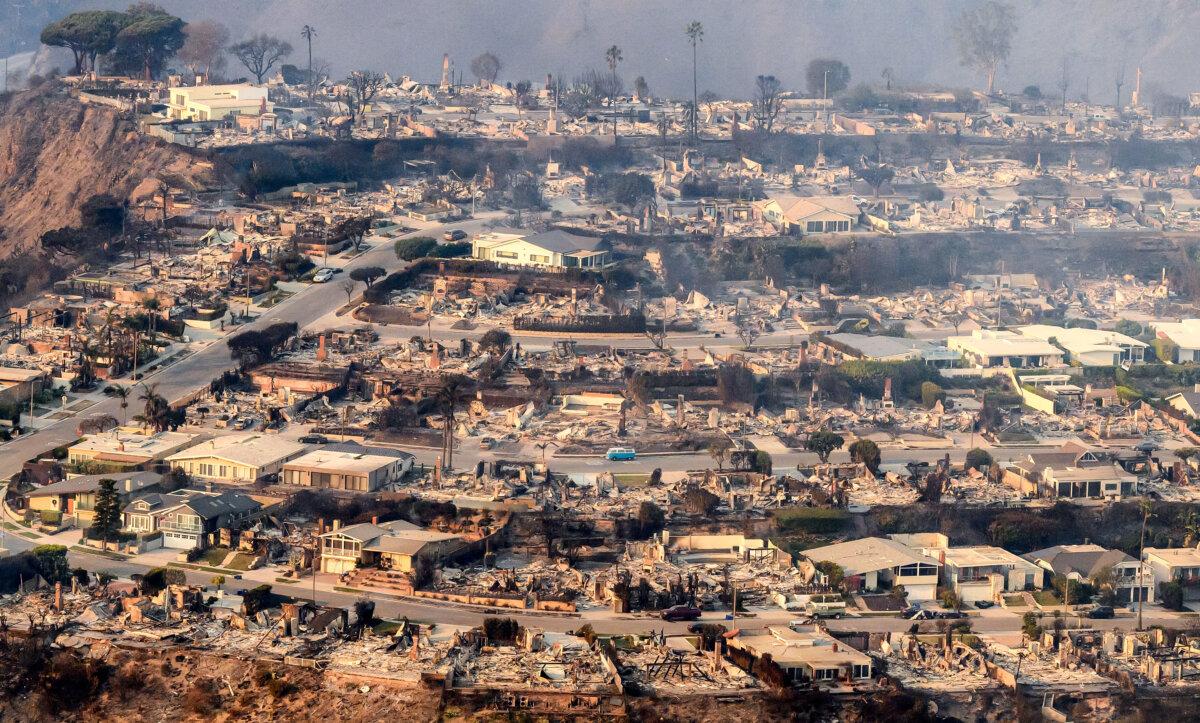 In this aerial view taken from a helicopter, burned homes are seen from above during the Palisades fire near the Pacific Palisades neighborhood of Los Angeles on Jan. 9, 2025. (Josh Edelson/AFP via Getty Images)