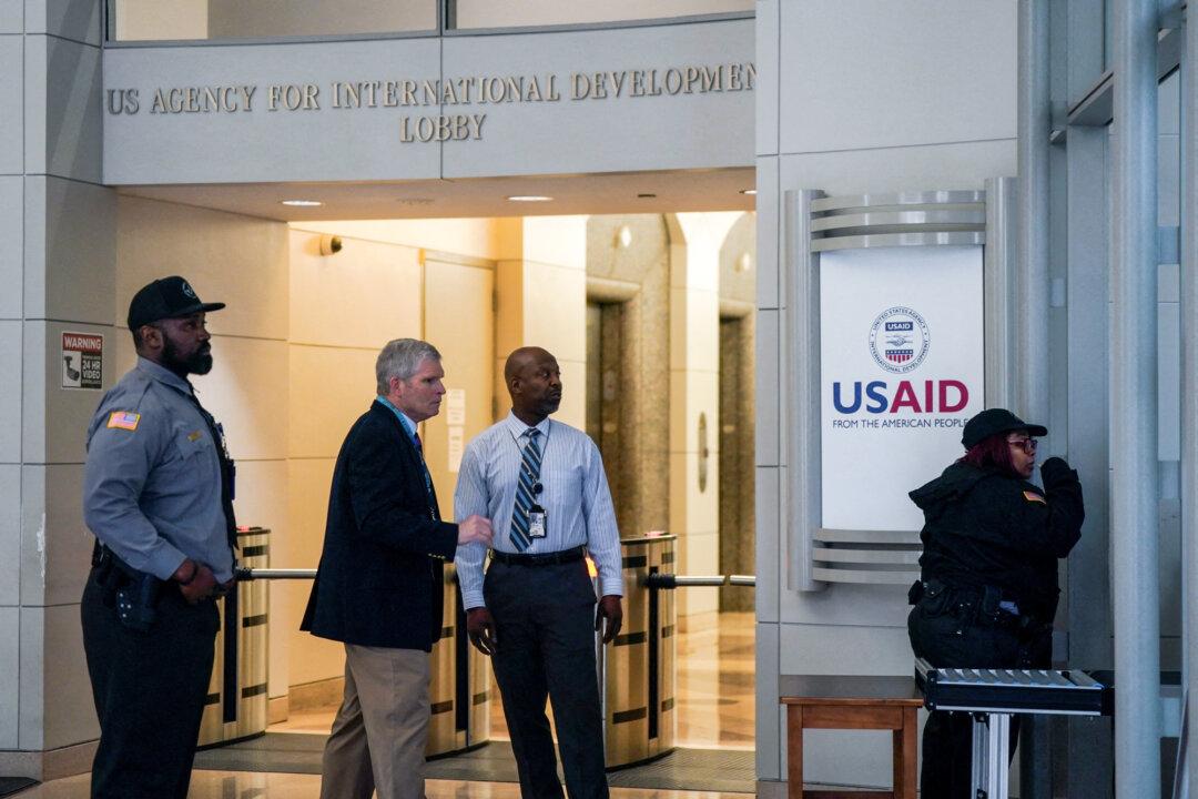 Security personnel work outside the closed the USAID building in Washington on Feb. 3, 2025. The Trump administration closed the agency’s offices on Feb. 3 and later placed most employees on administrative leave. (Kent Nishimura/Reuters)