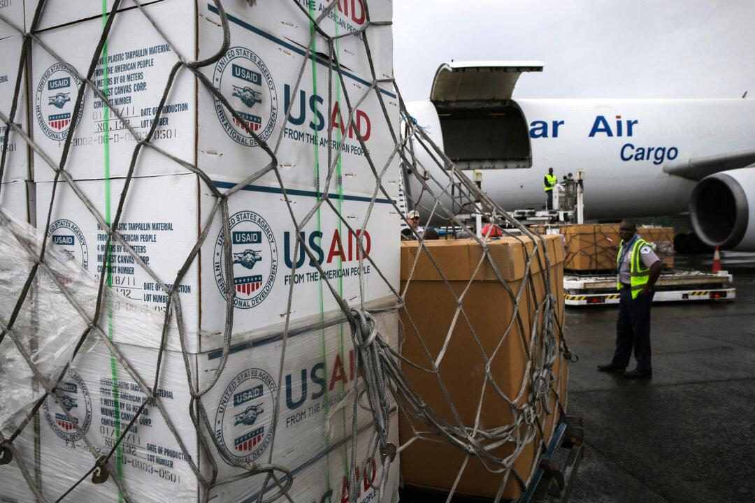Workers unload medical supplies to fight the Ebola epidemic from a USAID cargo flight in Harbel, Liberia, on Aug. 24, 2014. (John Moore/Getty Images)