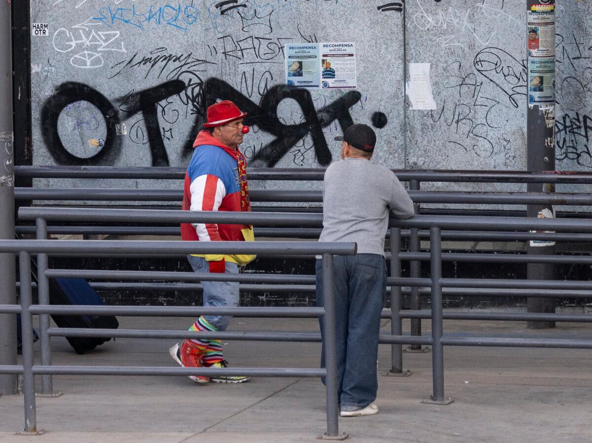 Two people prepare to enter the United States from Tijuana, Mexico into San Ysidro, Calif., on Jan. 29, 2025. (John Fredricks/The Epoch Times)