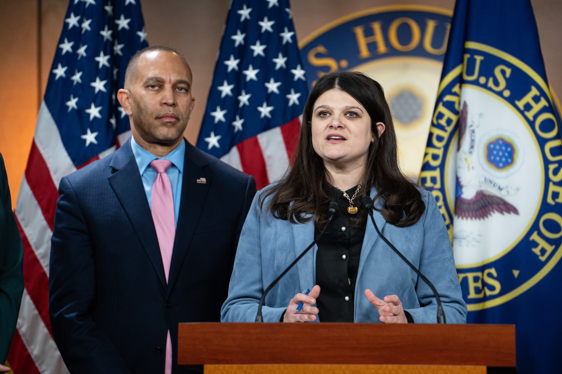 Rep. Haley Stevens (D-Mich.) (R), joined by House Minority Leader Hakeem Jeffries (D-N.Y.) and other House Democrats (out of frame), speaks during a news conference in Washington on Feb. 6, 2025. (Madalina Vasiliu/The Epoch Times)