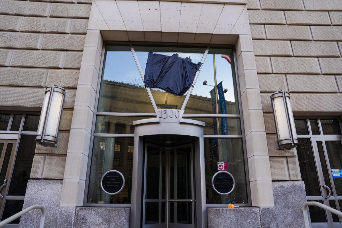 The U.S. Agency for International Development logo is covered in Washington on Feb. 7. 2025. (Madalina Vasiliu/The Epoch Times)