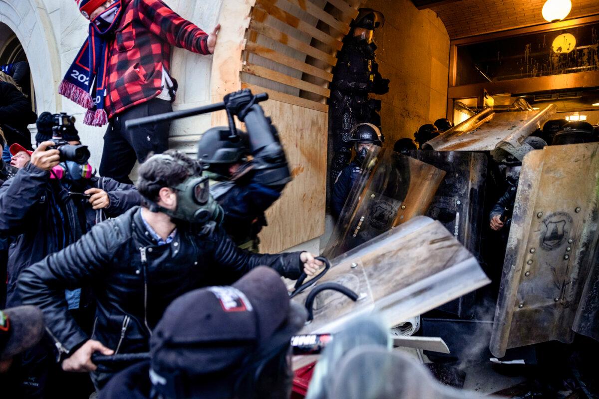Protesters clash with police and security forces as people try to breach the U.S. Capitol on Jan. 6, 2021. (Brent Stirton/Getty Images)