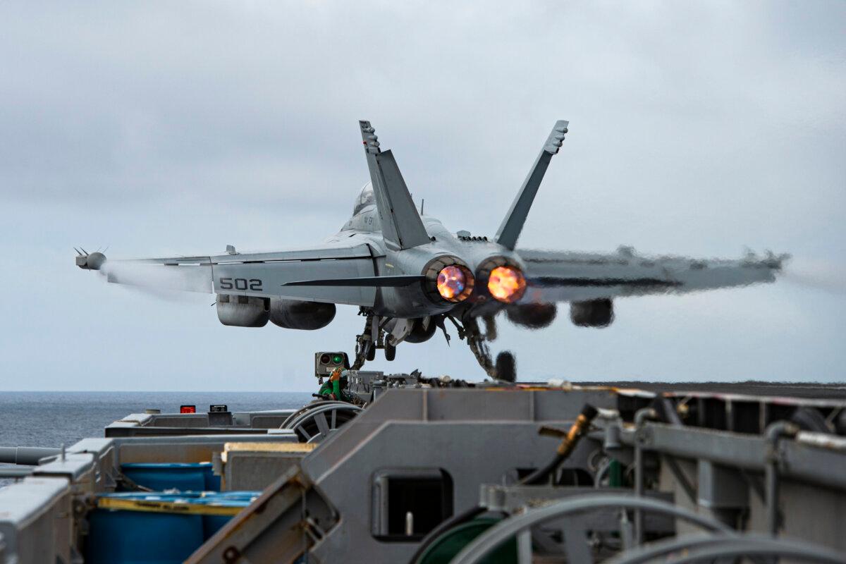 An E/A-18G Growler aircraft launches from the flight deck of the aircraft carrier USS Nimitz in the South China Sea on Feb. 12, 2023. (Mass Communication Specialist 3rd Class Joseph Calabrese/U.S. Navy via AP)