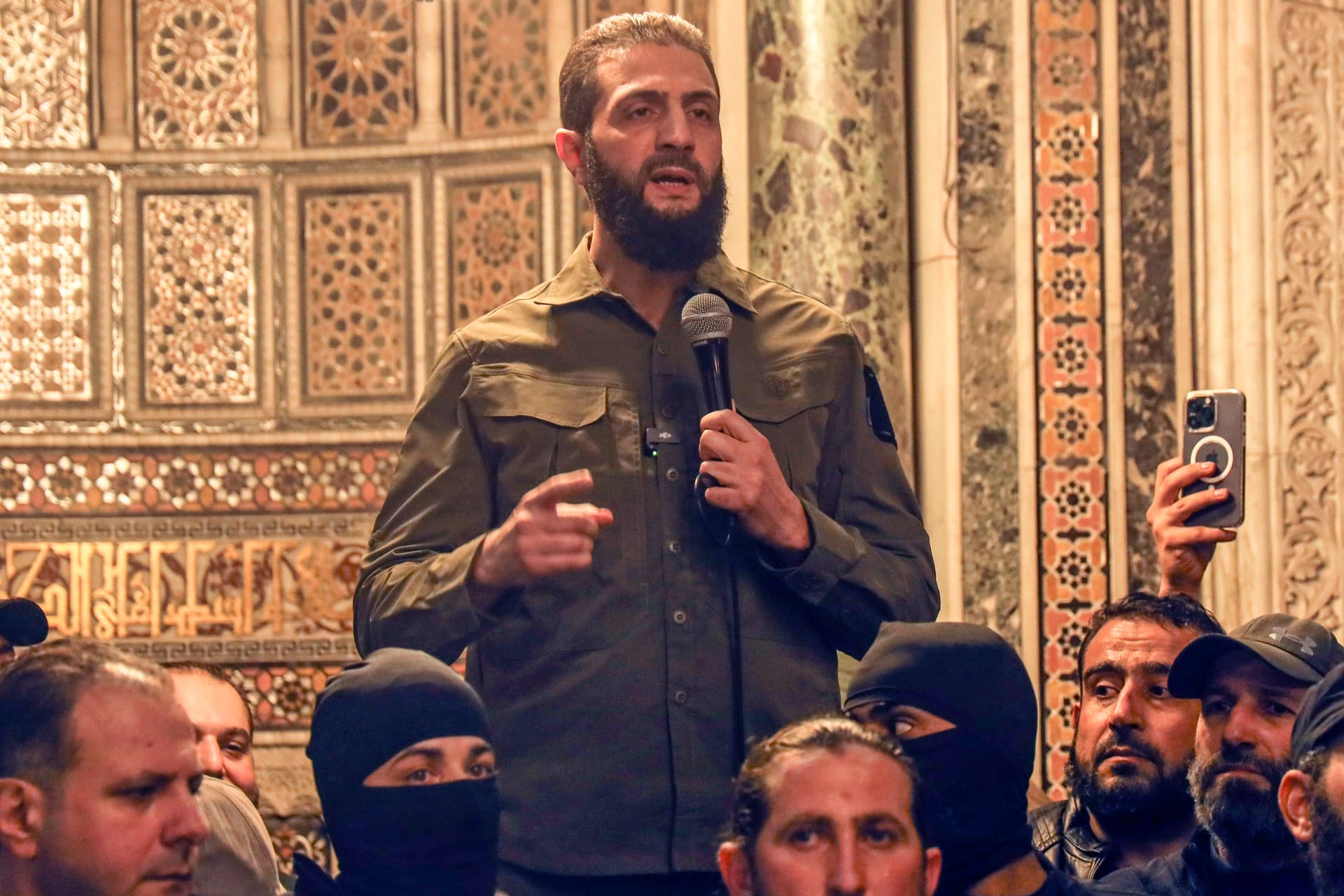 Ahmed al-Sharaa, also known by the nom de guerre Abu Mohammed al-Golani, speaks at the Umayyad Mosque in Damascus, Syria, on Dec. 8, 2024. (The Canadian Press/AP/Omar Albam)