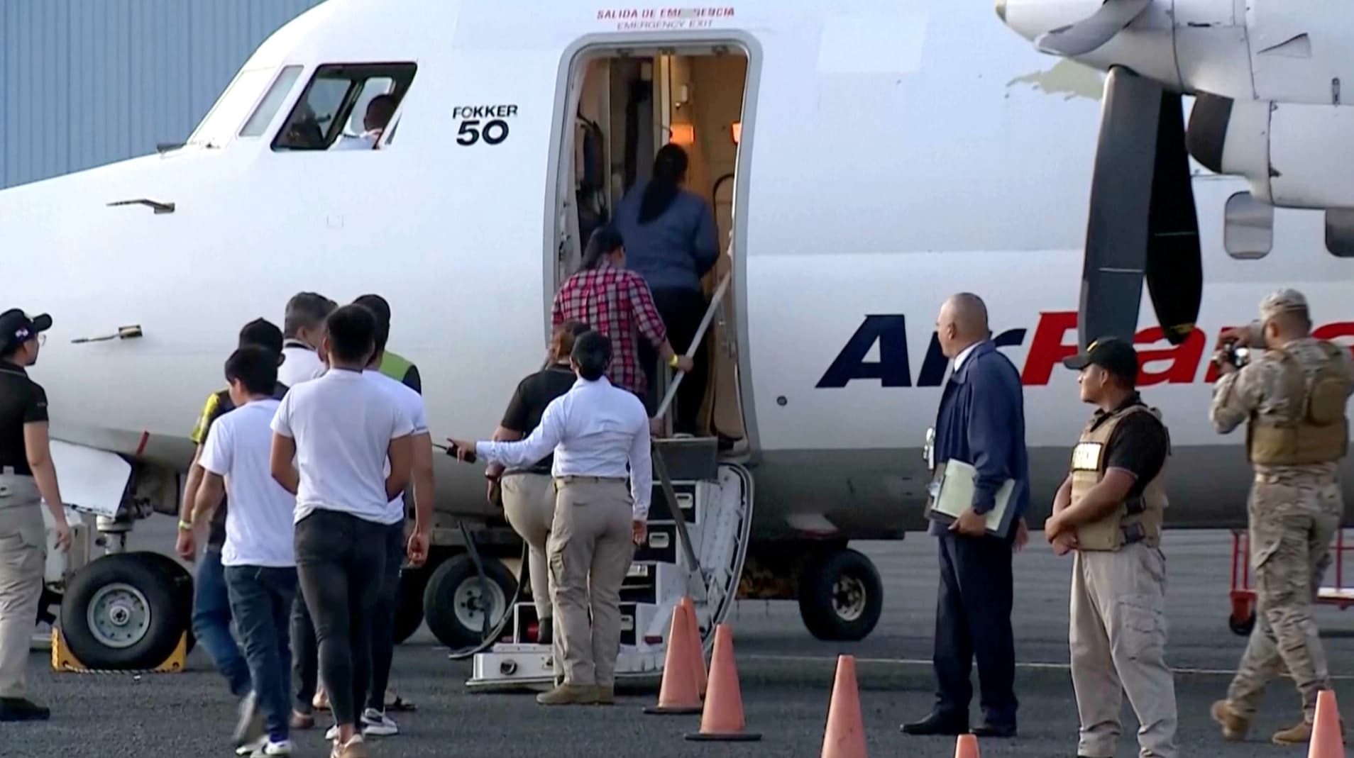 People board a deportation flight from Panama funded by the United States, in Panama City on Feb. 13, 2025. (Telemetro via AP/Screenshot via The Epoch Times)