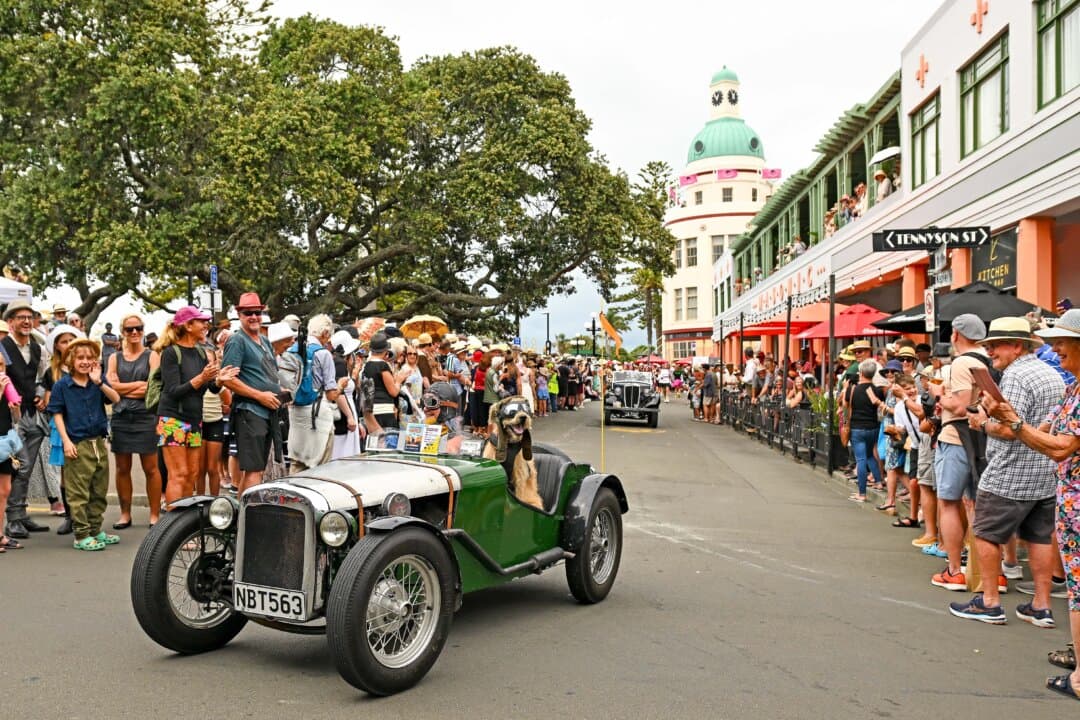 Vintage cars take part in a parade in Napier, New Zealand, on Feb. 15, 2025. The Napier Art Deco Festival 2025, running from Feb. 13 to 16, promises an immersive experience with over 200 events celebrating the city's iconic Art Deco architecture and heritage. This year's festival marks significant anniversaries, including the centennial of the Exposition Internationale des Arts Décoratifs et Industriels Modernes in Paris and features vintage car rallies, fashion shows, and steam train excursions. (Kerry Marshall/Getty Images)