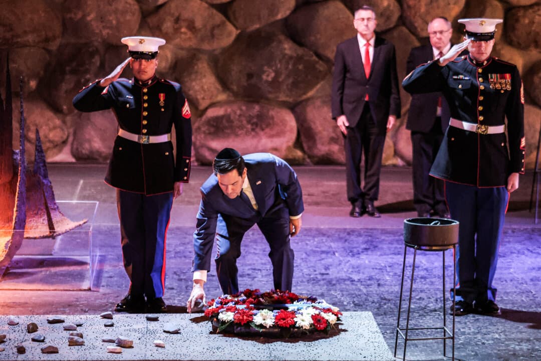 United States Marines perform a salute as U.S. Secretary of State Marco Rubio lays a wreath before the Eternal Flame at the Hall of Remembrance at the Yad Vashem Holocaust Memorial museum in Jerusalem on Feb. 16, 2025. (Jack Guez/POOL/AFP via Getty Images)