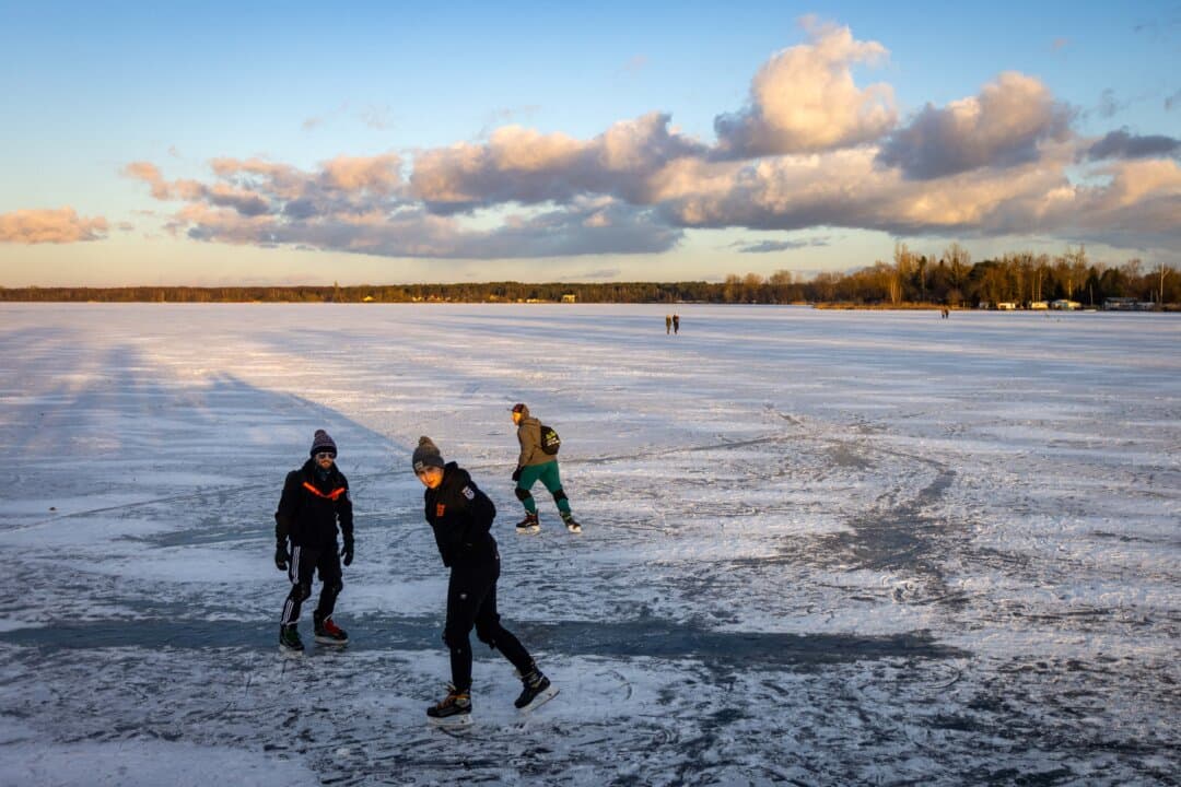 People skate on the frozen Zegrzynski Lake, 25 km north from Warsaw, Poland, on Feb. 16, 2025. (Wojtek Radwanski/AFP via Getty Images)