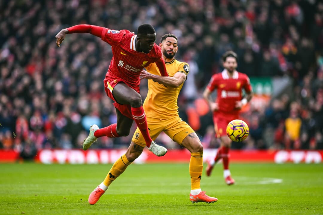 Ibrahima Konate of Liverpool is challenged by Matheus Cunha of Wolverhampton Wanderers during the Premier League match between Liverpool FC and Wolverhampton Wanderers FC at Anfield in Liverpool, England, on Feb. 16, 2025. (Stu Forster/Getty Images)
