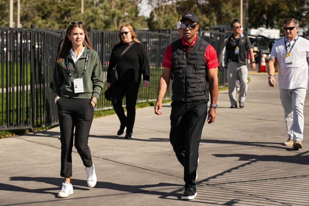 Kai Trump (L) and Tiger Woods arrive to the course during the final round of The Genesis Invitational 2025 at Torrey Pines Golf Course in La Jolla, Calif., on Feb. 16, 2025. (Michael Owens/Getty Images)