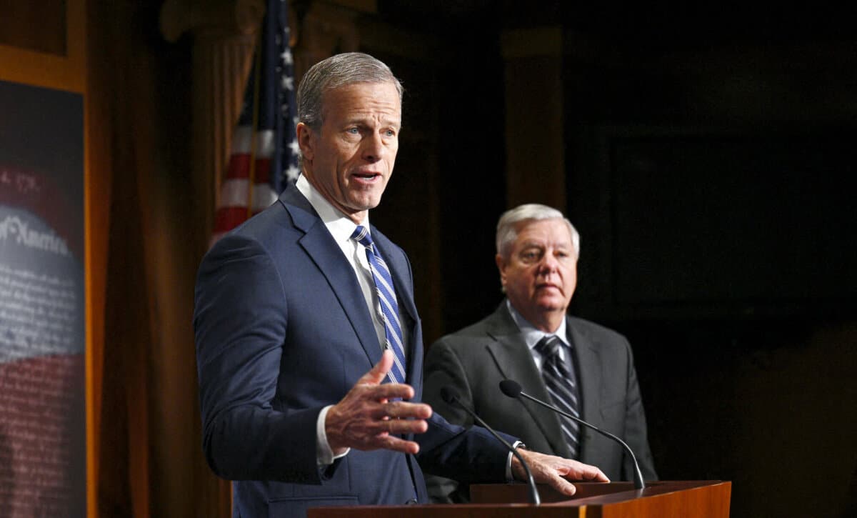 Sen. John Thune (R-S.D.) joins Senate Judiciary ranking member Lindsey Graham (R-S.C.) for a news conference on the Biden administration's "abuse of the immigration parole system" at the U.S. Capitol in Washington on Jan. 17, 2024. (Brendan Smialowski/AFP)