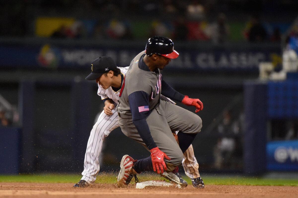 Hayato Sakamoto #6 of team Japan tags out Adam Jones #10 of team United States in the sixth inning during Game 2 of the Championship Round of the 2017 World Baseball Classic at Dodger Stadium in Los Angeles, California on March 21, 2017. (Harry How/Getty Images)