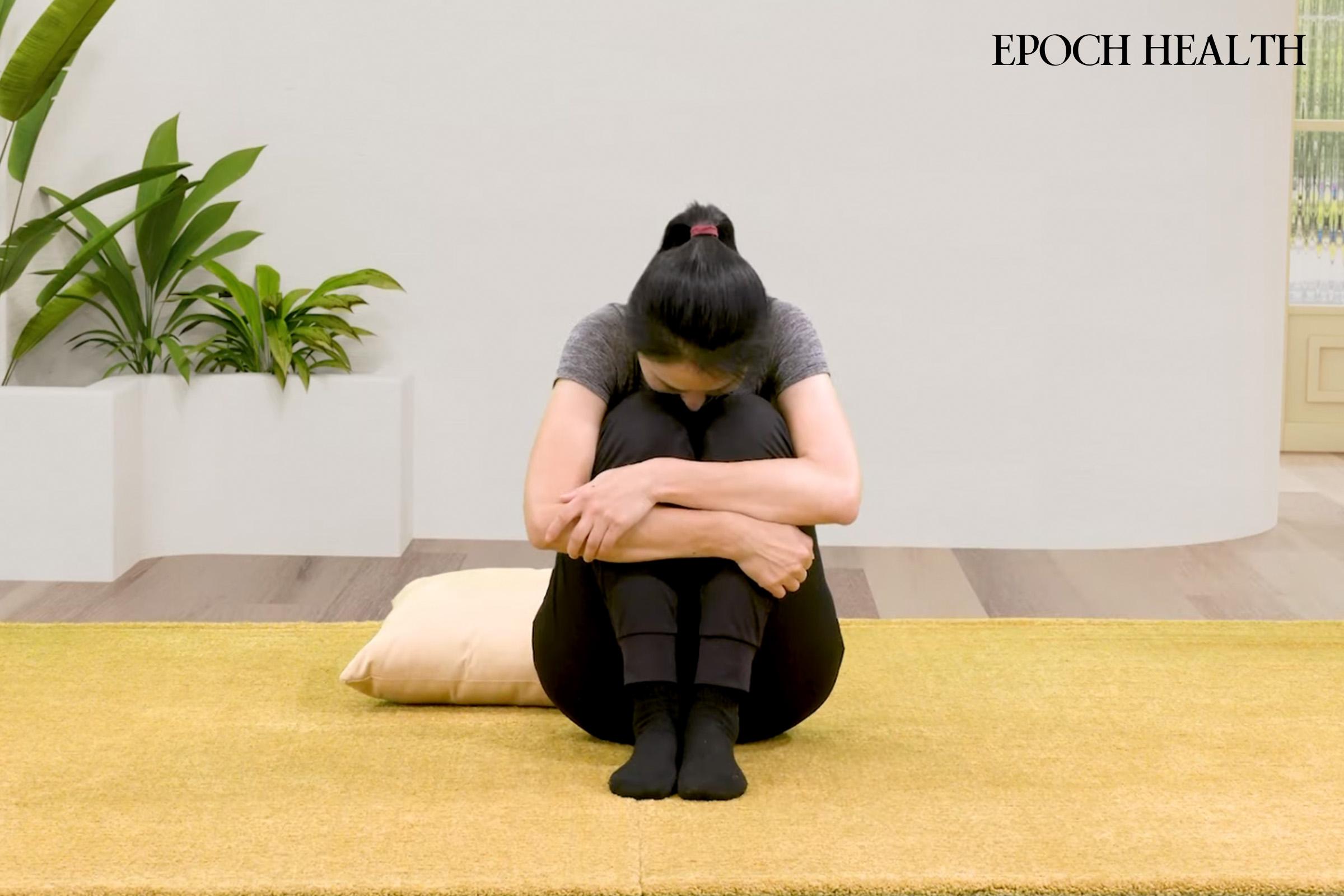 Seated Knee Hug. (The Epoch Times)
