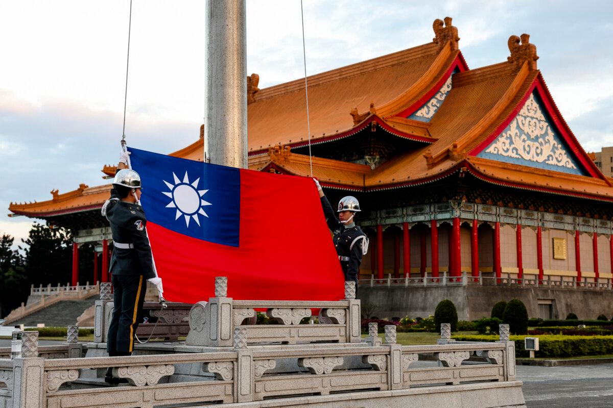 Guards raise Taiwan's national flag on the Democracy Boulevard at the Chiang Kai-shek Memorial Hall in Taipei on Nov. 29, 2024. (I-Hwa Cheng/AFP via Getty Images)