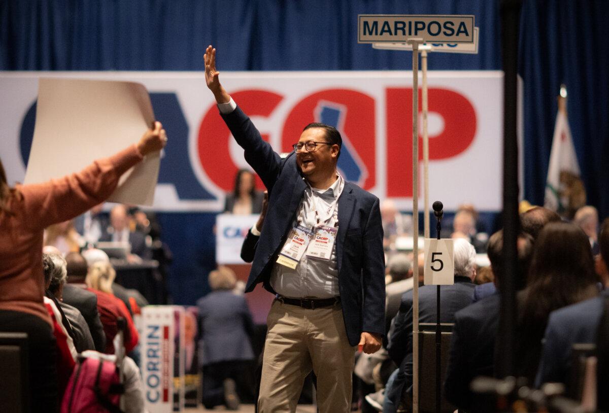 Jack Guerrero celebrates with supporters after winning the position of CAGOP treasurer in Sacramento, Calif., on March 16, 2025. (John Fredricks/The Epoch Times)
