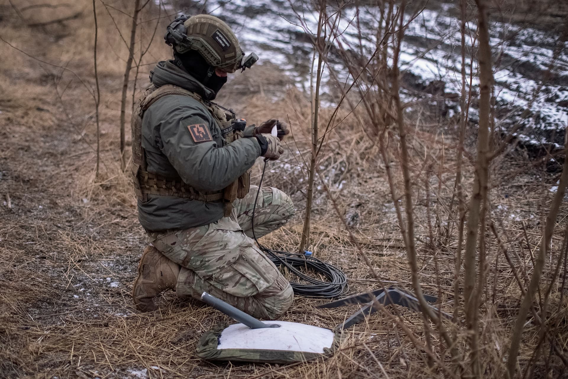 A Ukrainian serviceman of the 47th brigade prepares a Starlink satellite internet system at his position on the front line, amid Russia's attack near the town of Avdiivka, on Feb. 20, 2024. (Inna Varenytsia/File Photo /Reuters)