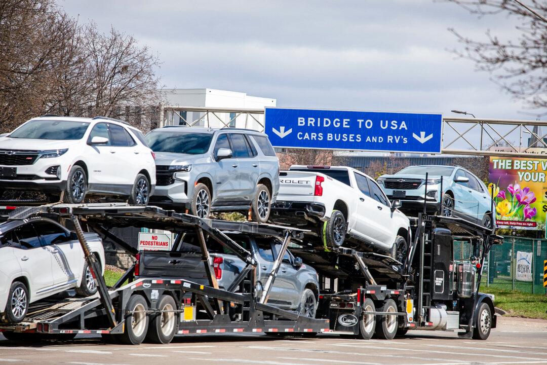A car hauler truck makes its way to the Ambassador Bridge to cross into Detroit from Windsor, Canada, on April 1, 2025. President Donald Trump has been referring to April 2 as “Liberation Day,” when his administration will begin implementing sweeping new tariffs on goods imported into the United States from other countries. (Bill Pugliano/Getty Images)