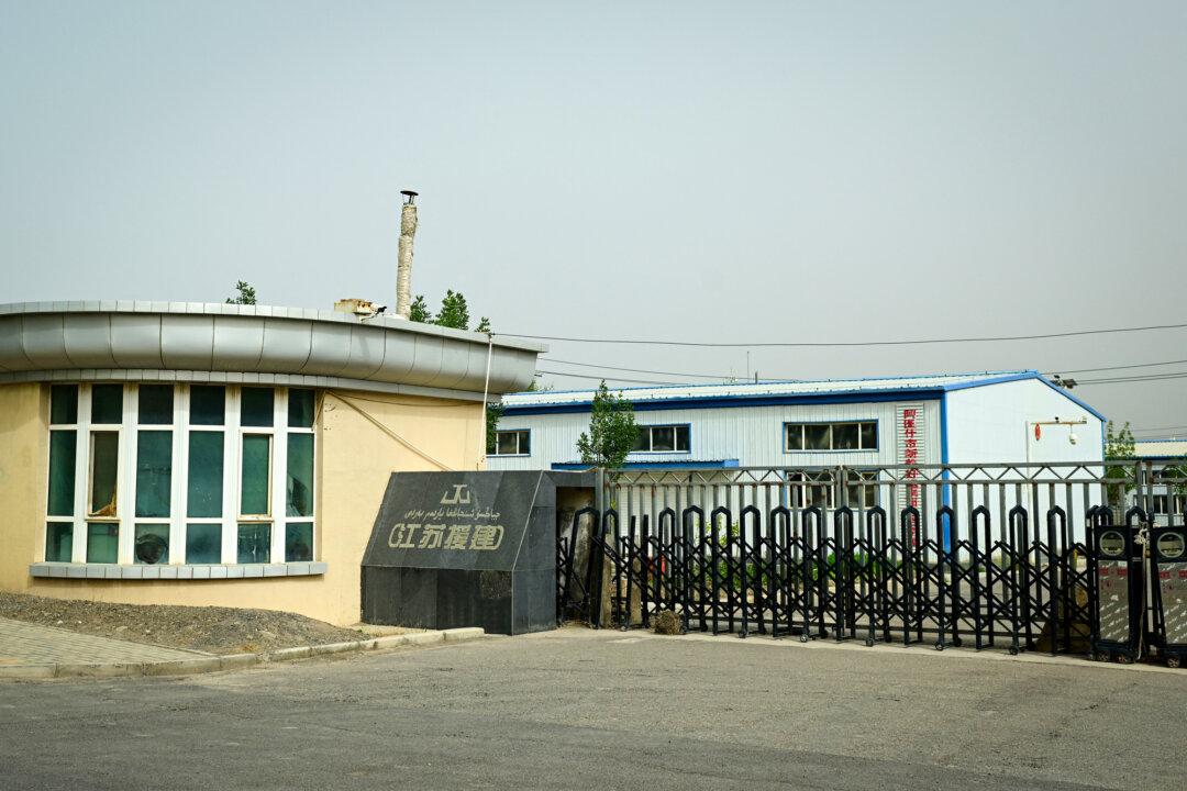 The entrance to an industrial area near a detention facility in Artux in Kizilsu, Xinjiang region, China, on July 19, 2023. The Chinese communist regime has been accused of using its mass collection of DNA at home to surveil and abuse the rights of minority groups such as the Uyghurs. (Pedro Pardo/AFP via Getty Images)