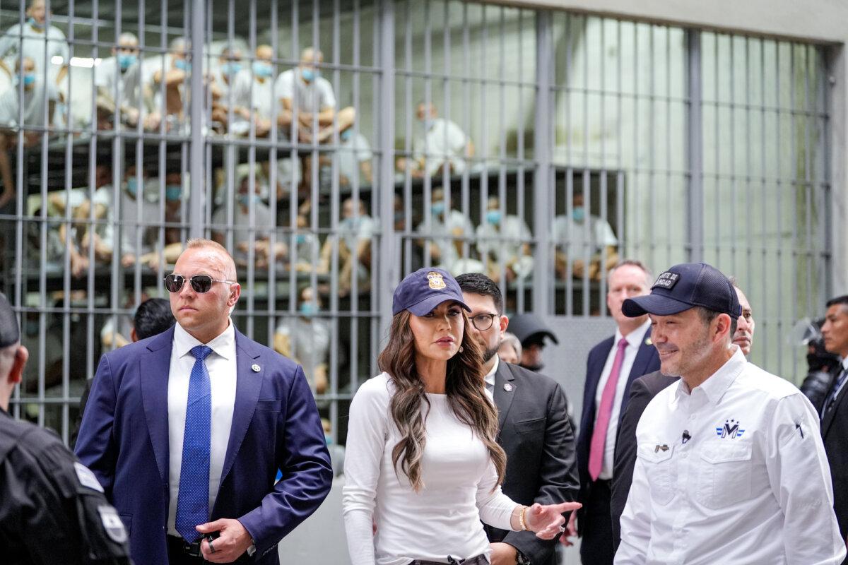 Department of Homeland Security Secretary Kristi Noem, accompanied by Salvadoran Minister of Justice and Public Security Héctor Gustavo Villatoro (R), tours the Terrorist Confinement Center (CECOT) in Tecoluca, El Salvador, on March 26, 2025. (Alex Brandon-Pool/Getty Images)