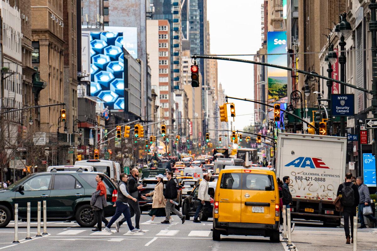 People cross a street in New York City on April 4, 2025. (Samira Bouaou/The Epoch Times)