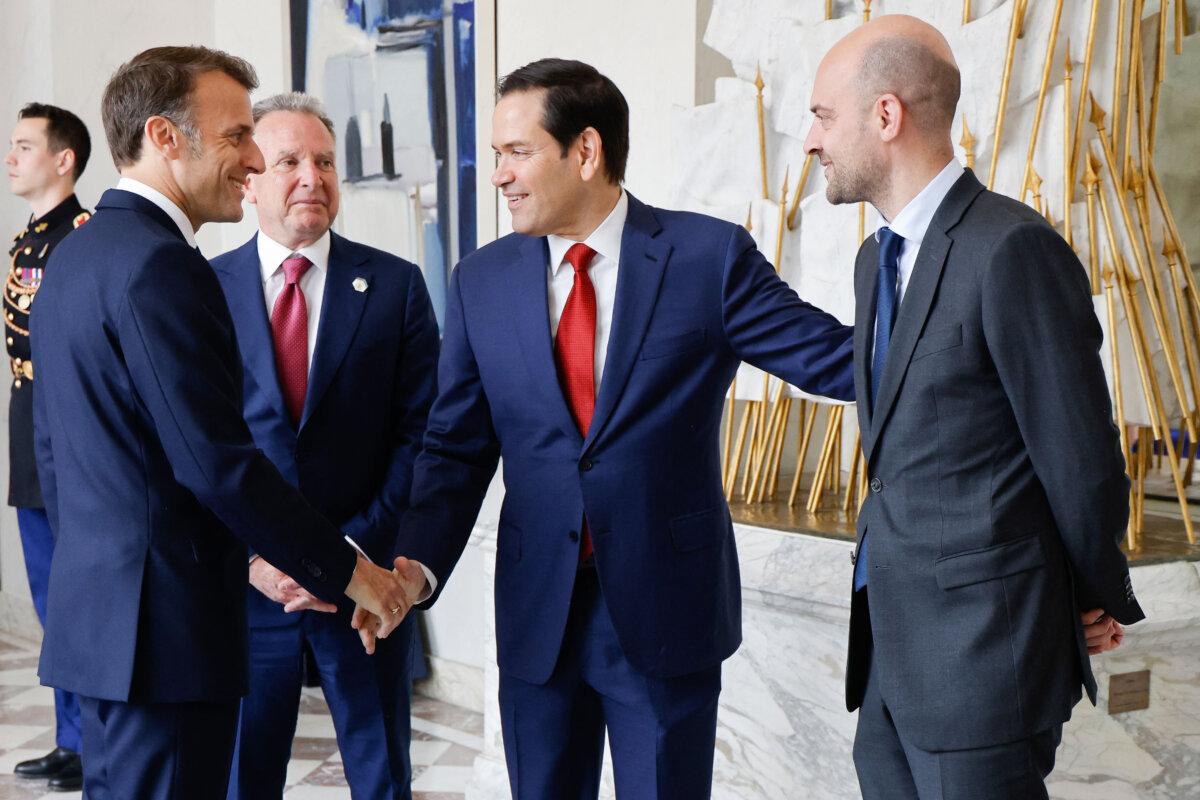 France's President Emmanuel Macron (L) shakes hands with U.S. Secretary of State Marco Rubio (2R) next to U.S. Special Envoy Steve Witkoff (C) and France's Minister for Europe and Foreign Affairs Jean-Noel Barrot on April 17, 2025. (Ludovic Marin/AFP via Getty Images)