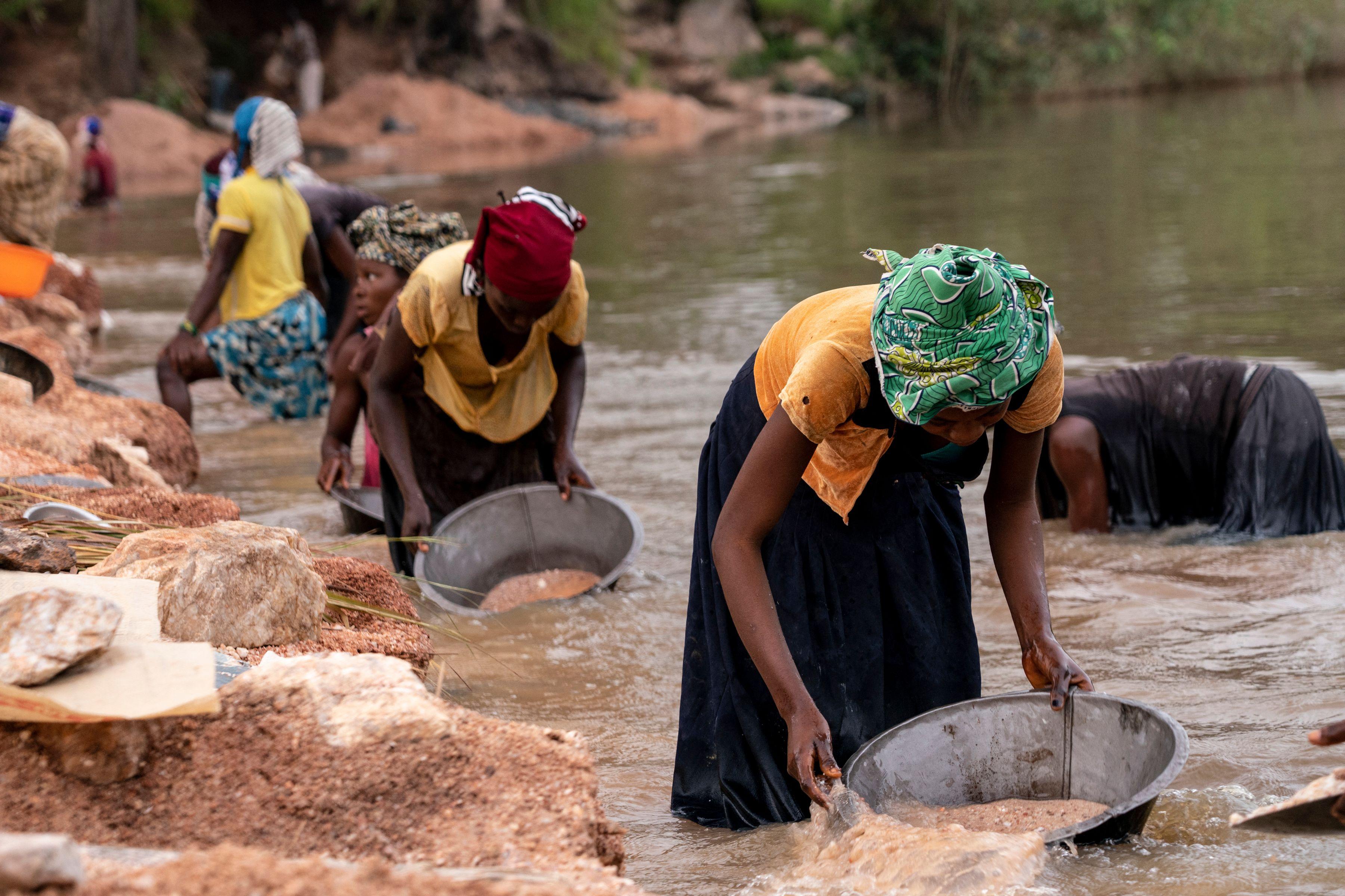 Artisanal miners collect gravel from the Lukushi river searching for cassiterite in Manono, Democratic Republic of Congo, on Feb. 17, 2022. (Junior Kannah/AFP via Getty Images)