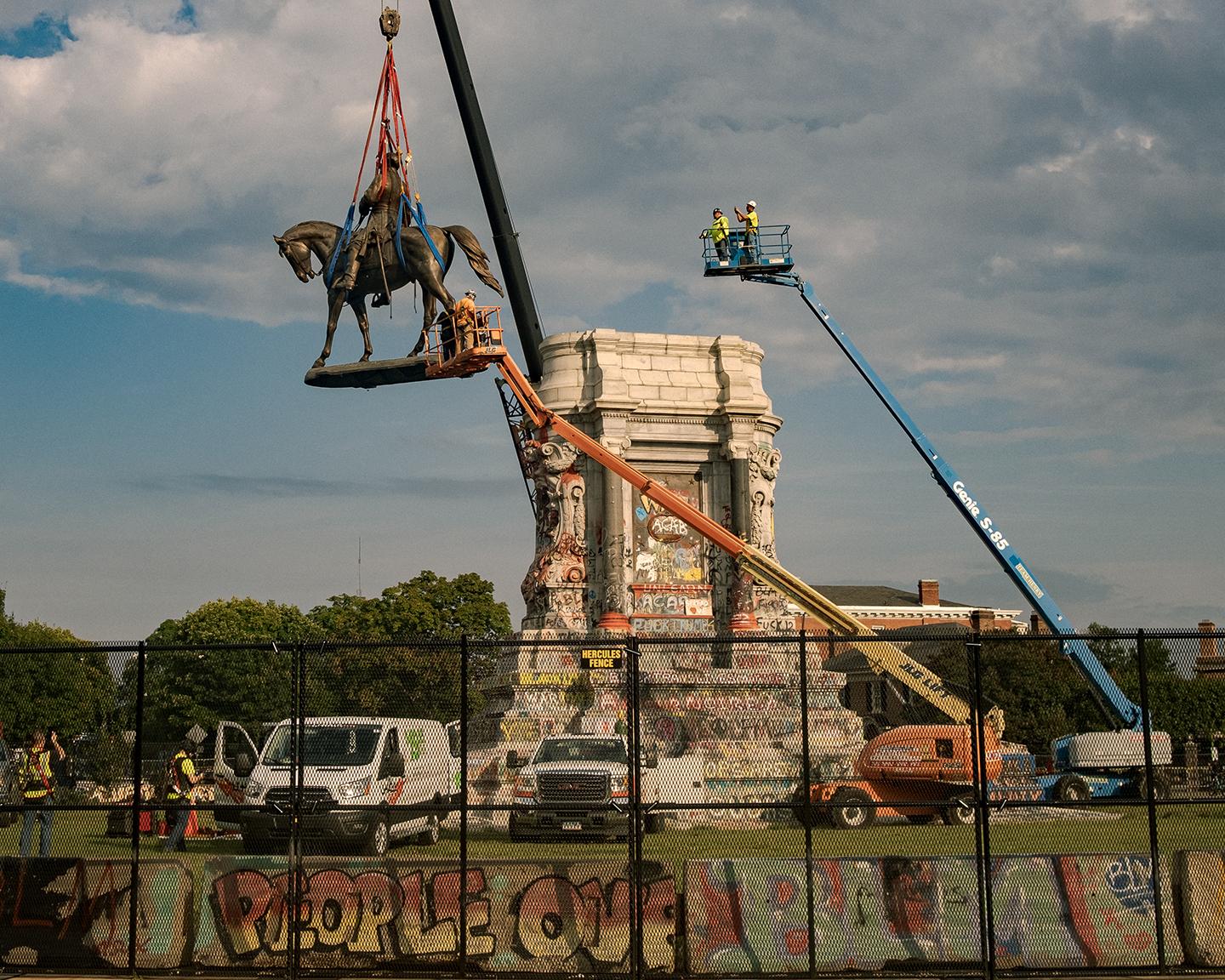 The statue of Robert E. Lee, which has towered over Monument Avenue since 1890, was removed from its plinth in Richmond, Va., on Sept. 8, 2021. (Pool/Getty Images)
