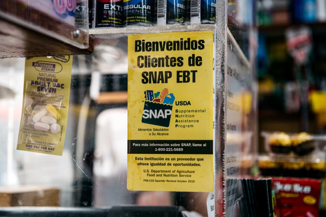 A sign alerting customers about SNAP food stamps benefits is displayed in a grocery store in the Brooklyn borough of New York City on Dec. 5, 2019. Health and Human Services Secretary Robert F. Kennedy Jr. has urged states to ban the use of SNAP funds for foods with high sugar content but little nutritional value, in efforts to promote healthier food consumption and reverse rising obesity rates among Americans. (Scott Heins/Getty Images)