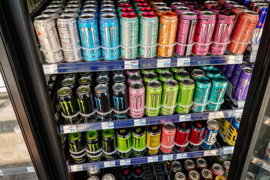 Cans of Monster Beverage Corporation energy drinks fill a store's shelves in Miami on April 16, 2025. Sweetened beverages—including energy drinks, juices, and powder mixes—account for about 9 percent of SNAP food stamps spending. (Joe Raedle/Getty Images)