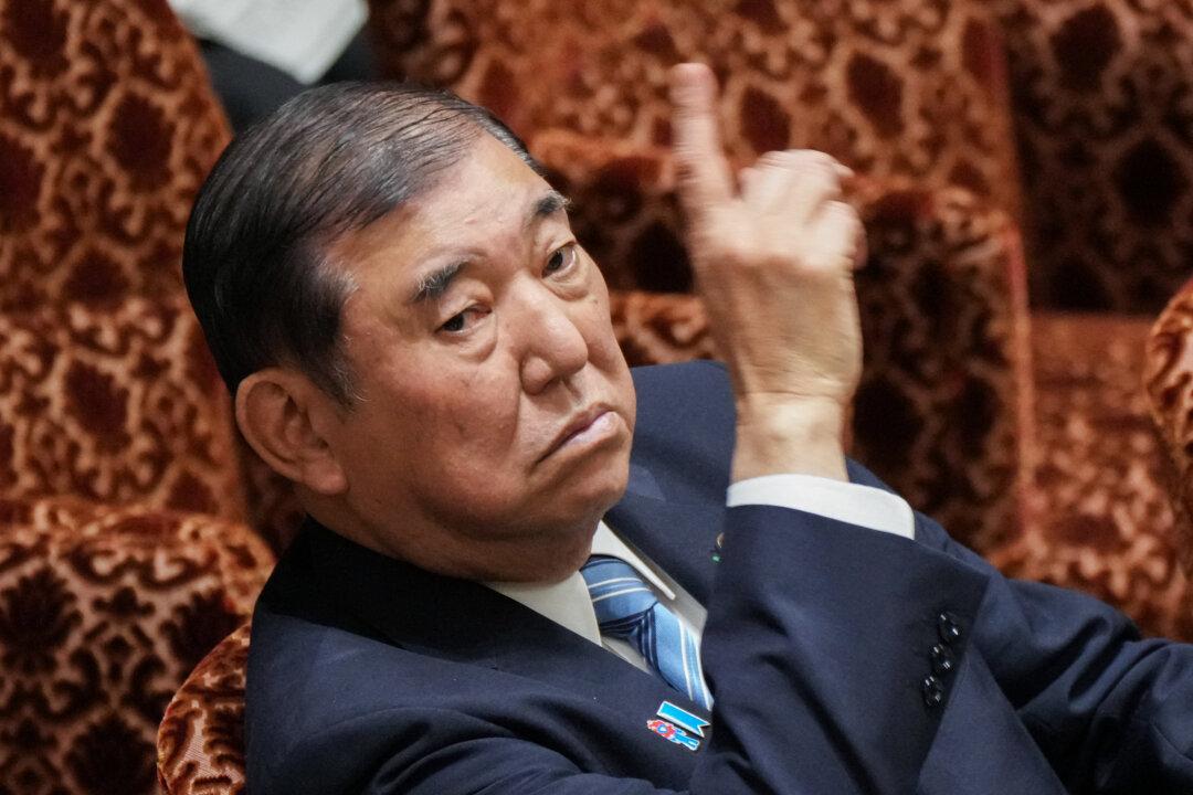 Japan's Prime Minister Shigeru Ishiba raises his hand to answer questions during a parliamentary committee session in Tokyo on April 21, 2025. (Kazuhiro Nogi/AFP via Getty Images)